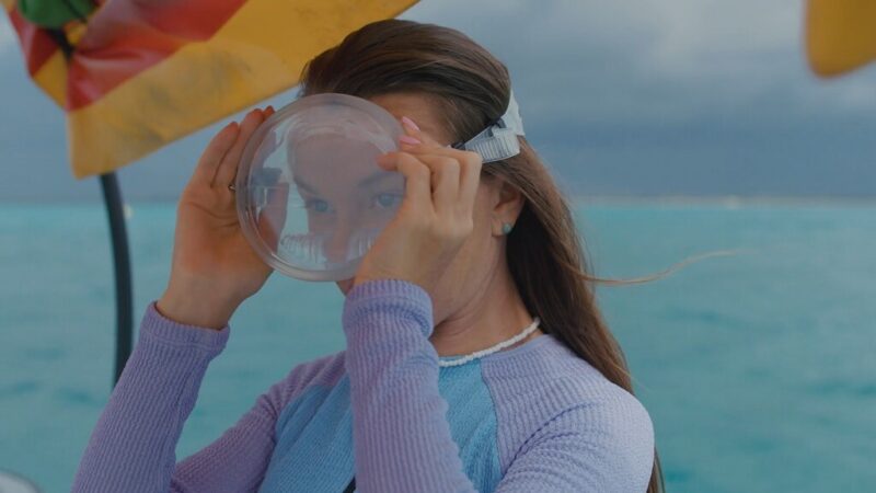 Woman Adjusting a Mask on Her Face